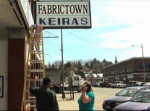 Vinny Matteis fixing his sign. Vinny Matteis fixing his sign.